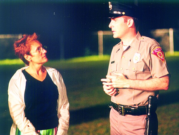 Randall Franks as “Officer Randy Kraft” takes direction from Martha Coolidge for “The Flamingo Rising.” (Randall Franks Media/Hallmark: Anthony Neste)